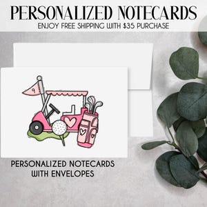 May include: White notecards with a golf-themed illustration. The design features a pink golf cart, golf ball, and golf bag. The text "PERSONALIZED NOTECARDS" and "PERSONALIZED NOTECARDS WITH ENVELOPES" are displayed.