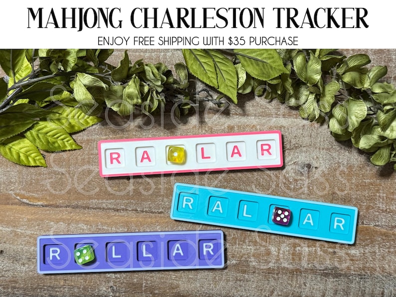 May include: Three Mahjong Charleston Tracker boards in pink, blue, and purple. Each board has the letters R, A, L, and R, with a die in the center. The text "MAHJONG CHARLESTON TRACKER" is at the top.
