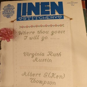 May include: A white linen cross stitch sampler with the quote "Where thou goest I will go."  The sampler also includes the names "Virginia Ruth Austin" and "Albert S(Ken) Thompson" and the date "12-27-43".
