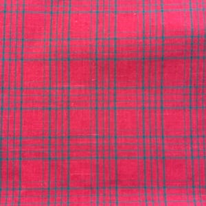 May include: Red fabric with a green plaid pattern.