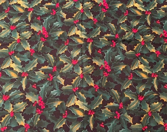 May include: A green and gold fabric with a repeating pattern of holly leaves and red berries.