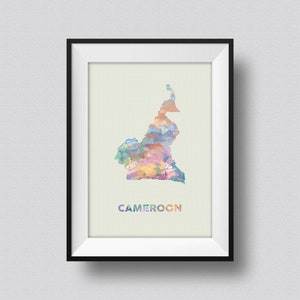 May include: A framed print of a watercolor map of Cameroon. The map is in shades of blue, green, yellow, and pink. The word "CAMEROON" is printed in white below the map.