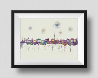May include: A colorful watercolor painting of the Berlin skyline with fireworks in the background. The painting is framed in a black frame.