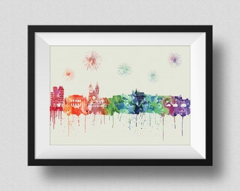May include: A watercolor painting of a city skyline with fireworks in the background. The city is depicted in shades of red, orange, yellow, green, blue, and purple. The fireworks are white and yellow.