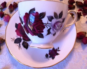 Tea Cup And Saucer With Red And White Roses