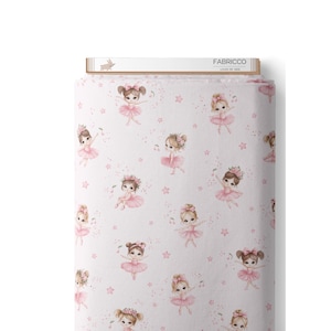 May include: Pink fabric with a repeating pattern of ballerinas wearing pink tutus and holding a musical note. The background is a light pink with small white stars.