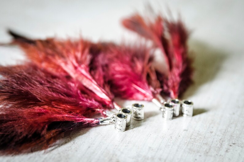 Dread beads with partridge feathers