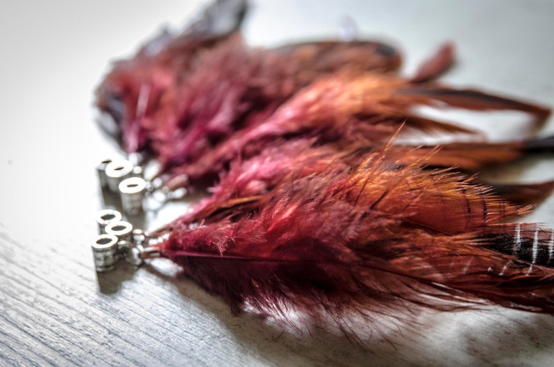 Dread beads with partridge feathers