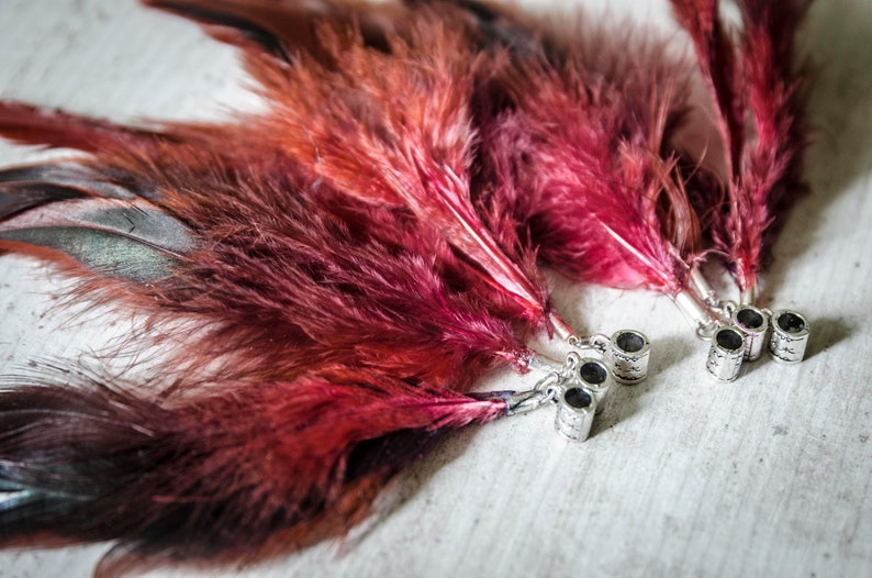 Dread beads with partridge feathers