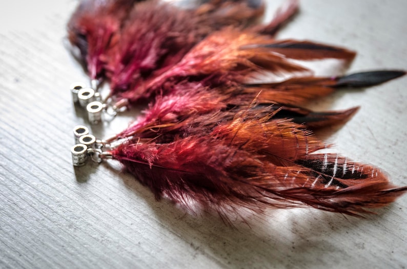 Dread beads with partridge feathers