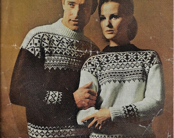 May include: A couple wearing matching brown and white patterned sweaters. The sweaters have a geometric design with a white background and brown accents.