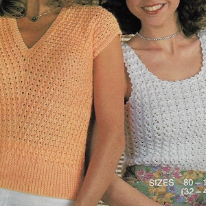 May include: Two women wearing crocheted tops. The woman on the left is wearing a peach colored top with short sleeves. The woman on the right is wearing a white sleeveless top. The text "SIZES 80 - 105 cm (32 - 42 ins)" is visible at the bottom of the image.
