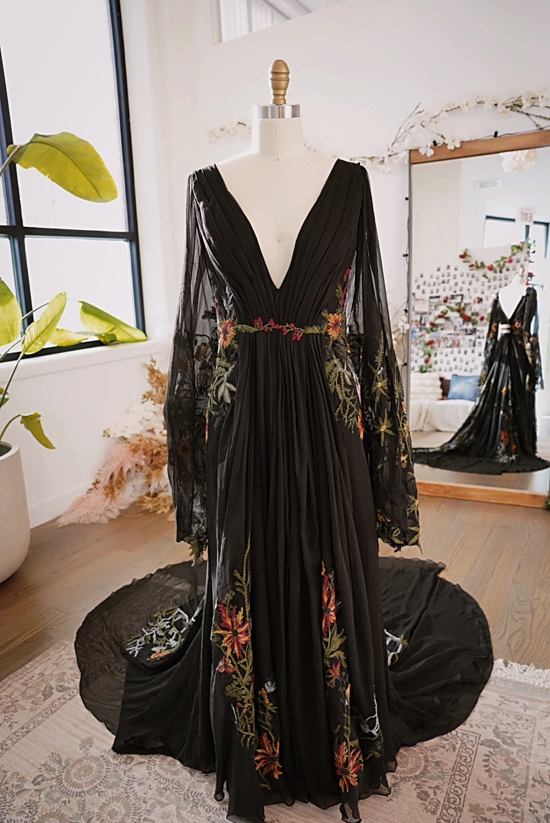 Black dress with embroidered flowers hotsell