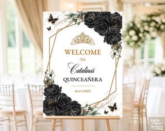 May include: A welcome sign for a quinceañera, with a gold geometric frame, black roses, butterflies, and the text "Welcome to Catalina's Quinceañera" with the date 06.15.20XX. The sign is displayed on a wooden easel.