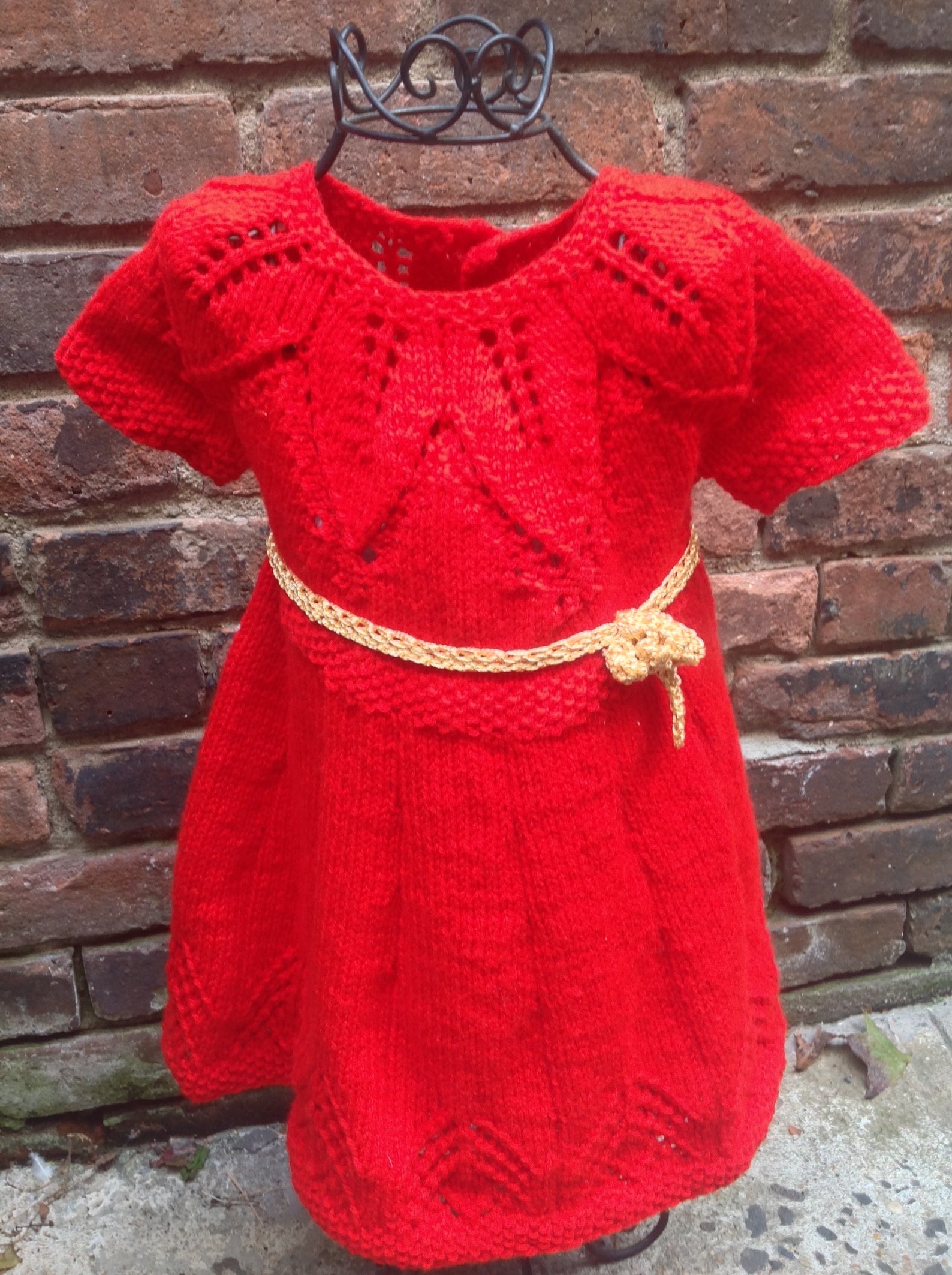 red newborn gown