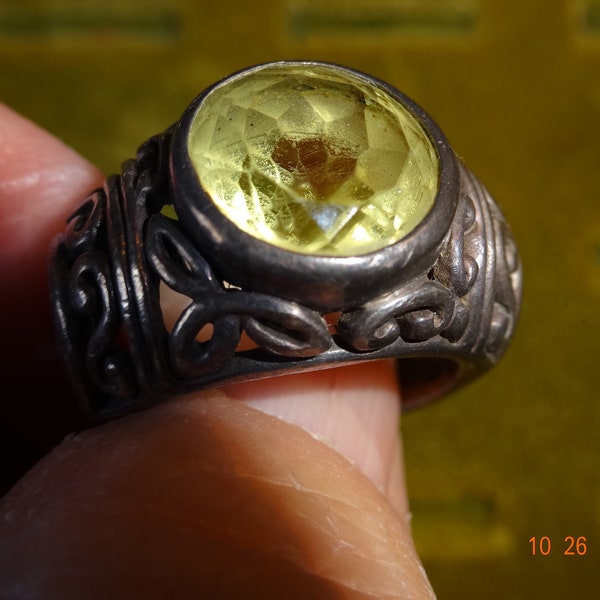 Ring marked  925 silver ornate sides, yellowish stone ,Peridot?   , solid styling lady or man