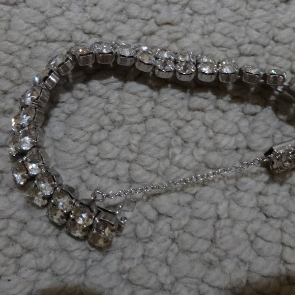 Sherman marked bracelet, rhinestones, 2 rows,safety chain,  6inch approx.  good  day, night