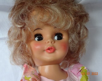 Vintage doll, plastic Reliable,Canada. 17.5inch, high heel, nylons,original dress. curly blonde ,side glance brown eyes.