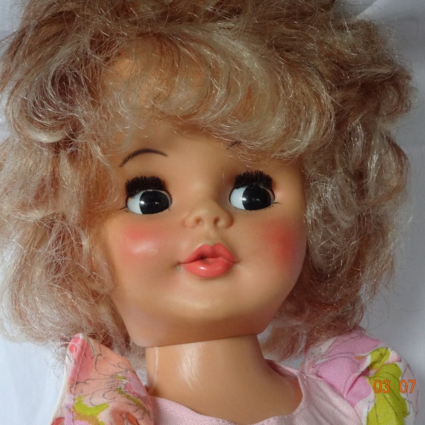 Vintage doll, plastic Reliable,Canada. 17.5inch, high heel, nylons,original dress. curly blonde ,side glance brown eyes.