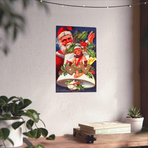 May include: Vintage Christmas-themed print featuring Santa Claus and an angel inside a bell. The angel holds heart-shaped decorations. The print has a dark blue background with holly and berries. The words "Sweetheart's Days" are at the bottom.