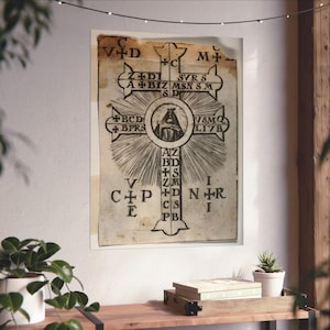 May include: A vintage black and white print of a cross with a figure of a person in the center. The cross is surrounded by a circle of radiating lines and letters. The letters are arranged in a pattern around the cross. The text on the cross reads: "C VID +C M+ Z+DI SVRS A+BIZ MSN SM SD BCD BPRS VSMQ LIVB AIZ BD+S ZM CS PB".