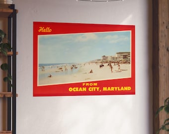 May include: A red and yellow postcard with the text "Hello from Ocean City, Maryland". The postcard features a photo of a beach scene with people swimming and sunbathing.