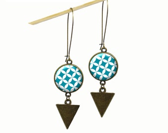 Long geometric peacock blue and white earrings