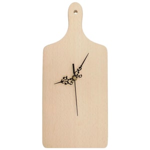 May include: A wooden chopping board with a clock face and black hands. The clock hands have a decorative design.