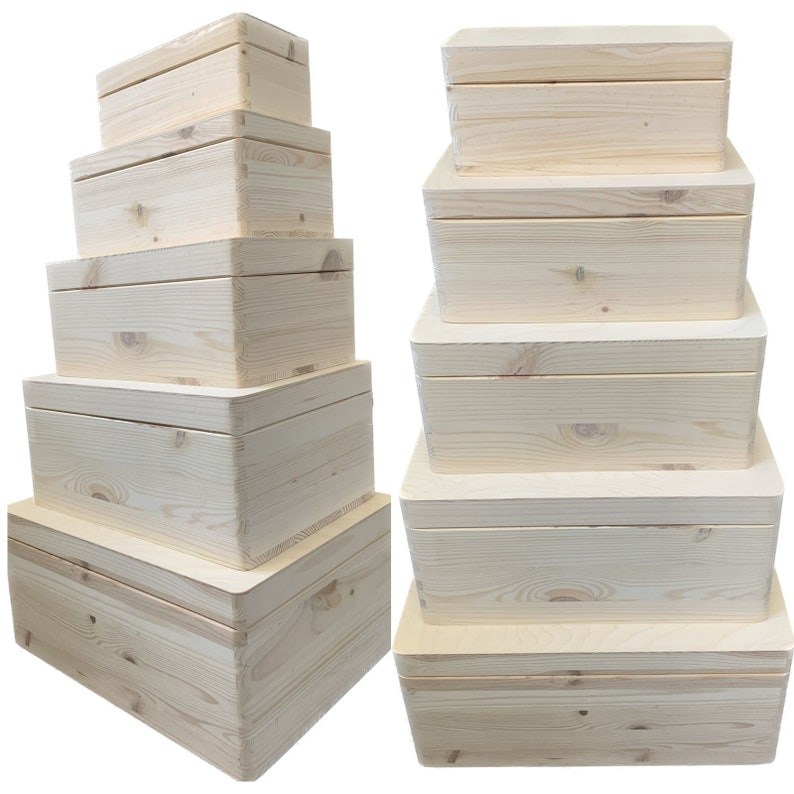 May include: Set of six unfinished wooden boxes, stacked in two columns. The boxes are made of natural wood and have a smooth, unpainted surface. They are ideal for crafting, storage, or display.