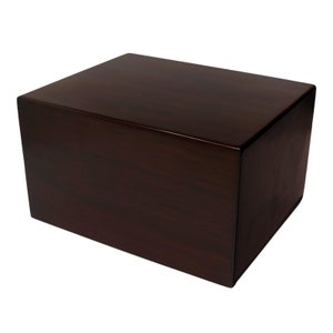 May include: A rectangular, dark brown wooden box with a glossy finish. The box has a simple, clean design with a smooth surface and is likely used for storage or display.