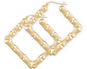 May include: A pair of gold square hoop earrings with a bamboo-like texture. The earrings are made of 14k gold and have a polished finish.