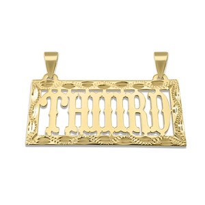 May include: A gold-colored pendant with the word "THIRD" cut out in a bold, stylized font. The pendant has a rectangular shape with decorative edges and two loops for a chain.