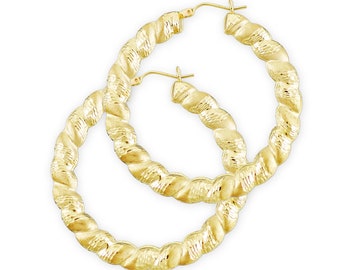 May include: A pair of gold hoop earrings with a twisted design. The earrings are made of 14k gold and have a polished finish.