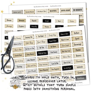May include: A collection of paper tags with inspirational words like "Dream," "Adventure," and "Good Vibes." The tags are in a vintage style with a cream background and black text. A pair of scissors is in the image.