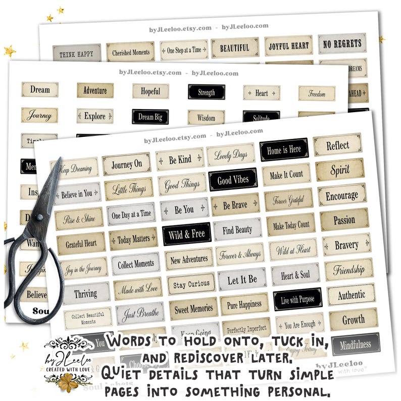 May include: A collection of paper tags with inspirational words like "Dream," "Adventure," and "Good Vibes." The tags are in a vintage style with a cream background and black text. A pair of scissors is in the image.
