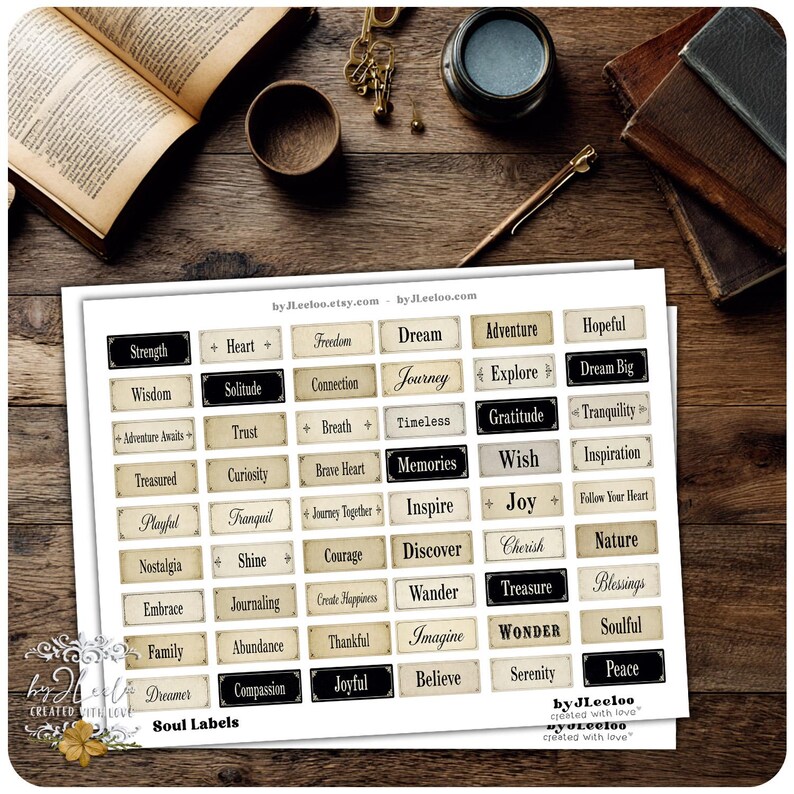May include: A sheet of Soul Labels with various inspirational words like "Dream," "Joy," and "Peace" in a vintage style. The labels are rectangular with a cream background and black or dark brown borders. The image includes books and stationery.