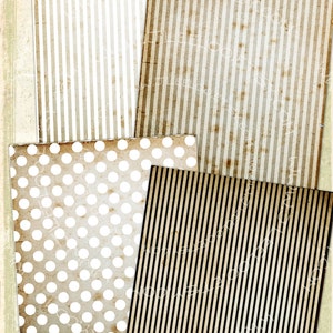 May include: Four different patterned paper sheets. The first sheet has white and brown vertical stripes. The second sheet has white and brown horizontal stripes. The third sheet has white polka dots on a brown background. The fourth sheet has black and brown vertical stripes.