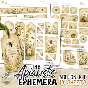 May include: A collection of vintage-style ephemera sheets featuring bee and floral illustrations. Includes tags with the text "Collect Beautiful Moments", labels, and decorative elements. The kit is titled "The Apiarist's Ephemera Add-On Kit" and contains 18 sheets.