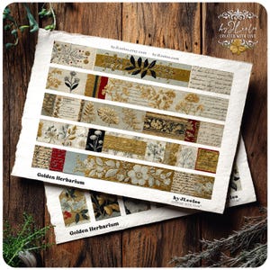 May include: Two sheets of paper with decorative botanical designs. The designs feature floral and leaf patterns in gold, black, and cream colors. The text "Golden Herbarium" is visible, along with the Etsy shop name.