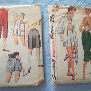 May include: Two sewing patterns for clothing. The pattern on the left is Simplicity Printed Pattern 350 and the pattern on the right is Simplicity Printed Pattern 25c. Both patterns feature illustrations of women wearing different styles of shorts.