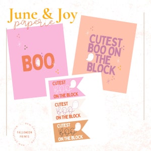 Puede incluir: Impresiones de temática Halloween en rosa y melocotón con las palabras "BOO" y "Cutest Boo on the Block". Las impresiones presentan ilustraciones de fantasmas y elementos decorativos. Las palabras "June & Joy paperie" están en la parte superior.