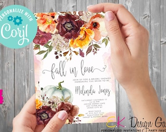 May include: A bridal shower invitation with a watercolour floral design featuring pumpkins, leaves, and flowers in shades of orange, yellow, red, and pink. The text "Fall in love" is written in a cursive font. The invitation includes the bride-to-be's name, Melinda Jones, the date and time of the shower, and the location. The invitation also includes information about where the bride-to-be is registered.
