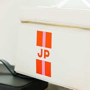 Custodia da treno in pelle con monogramma a righe