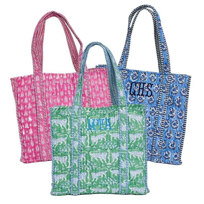 three colorful tote bags with different patterns and colors.