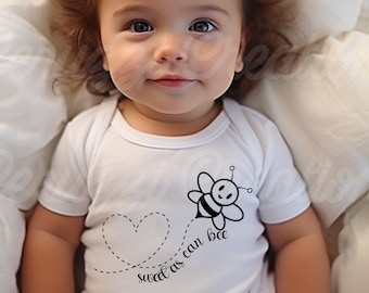 May include: A baby wearing a white onesie with a black and white bee graphic and the text "sweet as can bee". The baby has brown curly hair and is lying on a white surface.