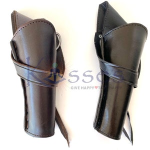 May include: Two leather holsters for guns. One is brown and the other is black. Both have a strap to secure them to a belt.