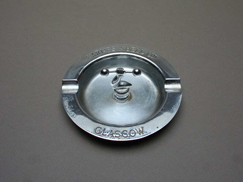 Unusual smoker gift idea Featuring a muscular arm and a dumbbell Vintage 1930s Antique advertising chrome ashtray