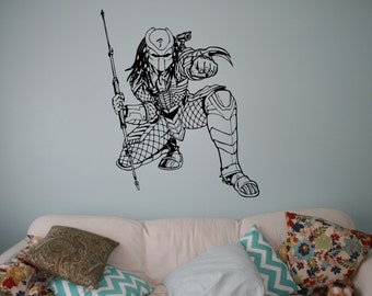 May include: Black and white illustration of a Predator character from the movie franchise. The Predator is holding a spear and is in a crouched position. The illustration is on a light blue wall.