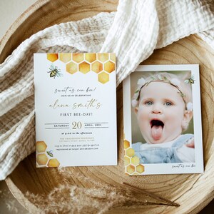 May include: A yellow and gold honeycomb pattern with a bee on a white background. The text "sweet as can bee!" is written in gold script. The text "Join us in celebrating Alena Smith's First Bee-Day!" is written in black. The text "Saturday, April 20, 2021, at 4:00 in the afternoon, The Henderson Residence, 123 Main Street, Dallas, TX 75222, RSVP to [phone number] by April [date], registered at Target and Amazon.com" is written in black.