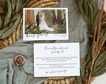 May include: A wedding thank you card featuring a photograph of the couple in a woodland setting. The card has a minimalist design with the text "Thank you" and a heart symbol. The text "Aline + Kaique 04.20.21" is printed below the photo.